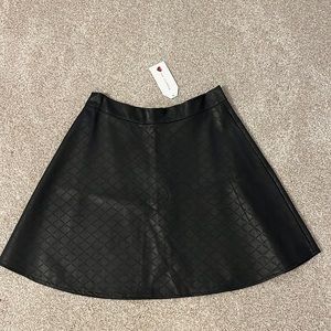 Faux leather mini skirt. Size large. New!